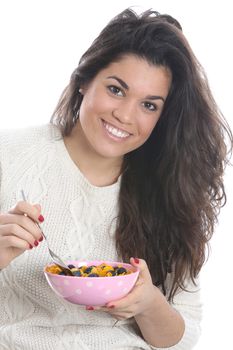 Model Released. Young Woman Eating Breakfast Cereal