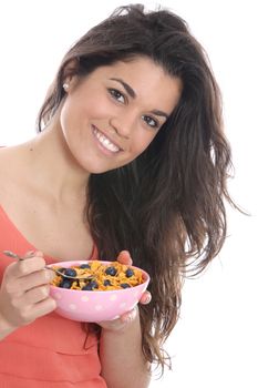 Model Released. Young Woman Eating Breakfast Cereal