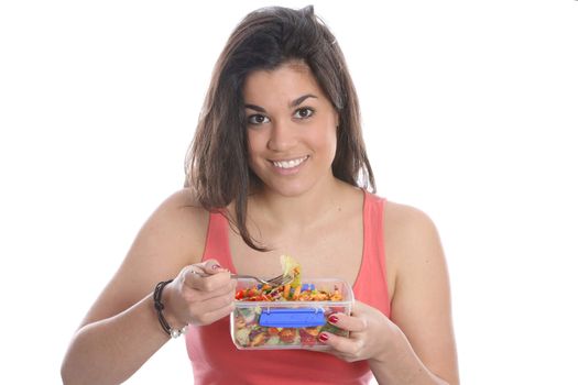 Model Released. Young Woman Eating Pasta Salad