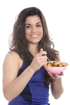 Model Released. Young Woman Eating Breakfast Cereal