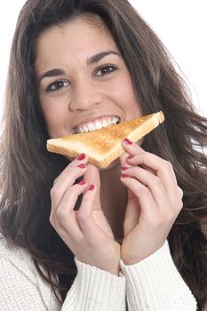 Model Released. Young Woman Eating a Slice of Toast