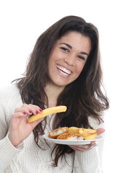 Model Released. Young Woman Eating Fish and Chips