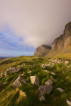 Scenic coastal cliffs on island Vaeroy on Lofoten islands in Norway