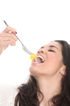 Model Released. Young Woman Eating Fresh Fruit Salad