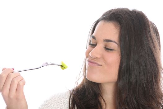 Model Released. Young Woman Eating Fresh Fruit Salad