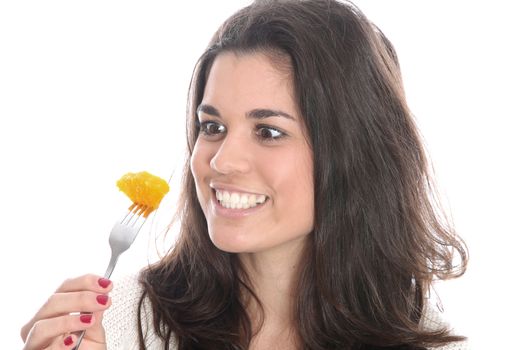 Model Released. Young Woman Eating Fresh Fruit Salad