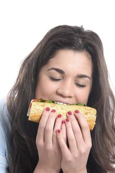 Model Released. Young Woman Eating Cheese and Tomato Roll