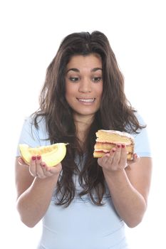 Model Released. Young Woman Holding Melon and Cake