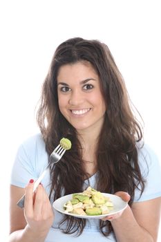 Model Released. Young Woman Eating Chicken and Avocado Salad