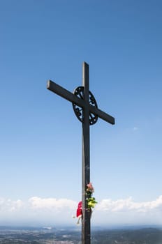 God Cross with flowers and sky background