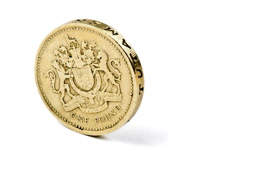 A British �1 Coin over a white background.
