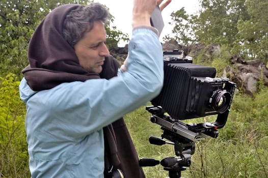 Cardet - France - May 18th, 19th and 20th, 2013 - European Cup of the gold diggers in river. photographer in nature with photographic equipment large size of studio