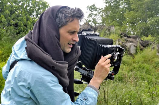 Cardet - France - May 18th, 19th and 20th, 2013 - European Cup of the gold diggers in river. photographer in nature with photographic equipment large size of studio