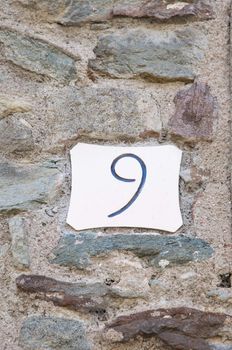 number 9 with stone wall