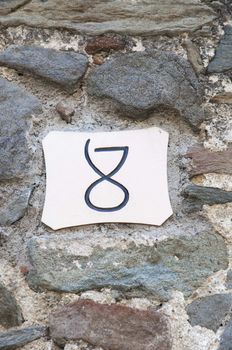 number 8 with stone wall