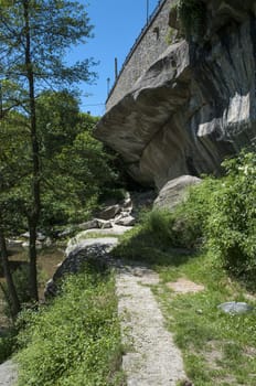 huge stone mountain surrounded by vegetation