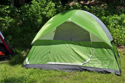 Camping outdoor with green tent