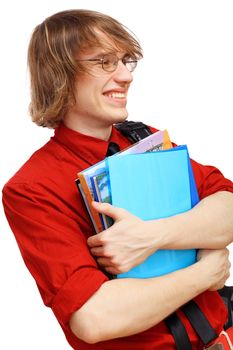 Happy smiling student standing and holding books