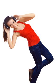 Happy smiling girl dancing and listening to music