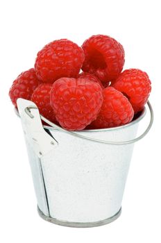 Perfect Ripe Raspberries in Tin Bucket isolated on white background