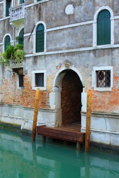 Beautiful romantic Venetian scenery. Street, canal, bridge. Venice. Italy