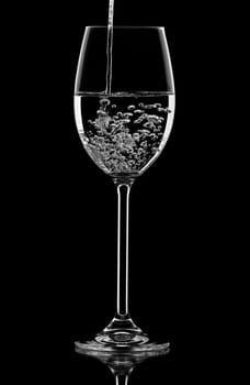 pouring water in the wineglass