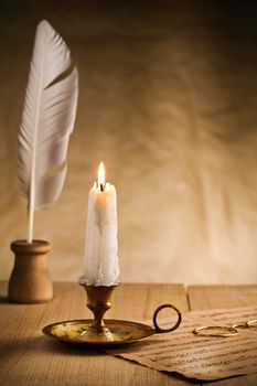 burning candle in vintage candlestick