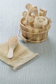 hairbrush on bast with wooden bucket