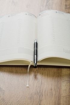 open notebook with pen
