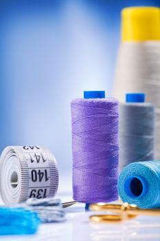 sewing spools with threads and other items