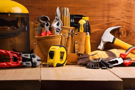 set of working tools on wooden boards