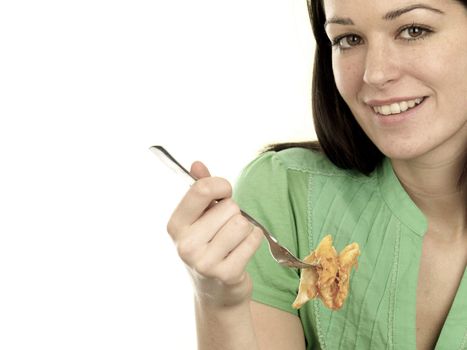 Young Woman Eating Pasta Bake. Model Released