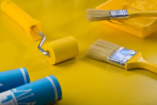 tools fot painting on yellow table