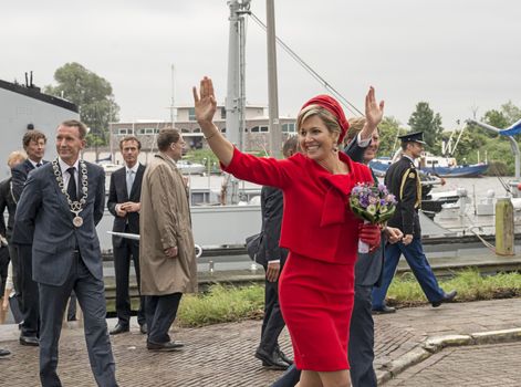 Hellevoetsluis,HOLLAND - JUNE 21:King Willem Alexander and Queen maxima showing to the dutch citizens,on June 21,2013 in Hellevoetsluis,Holland.They visit the citizins because of his coronation