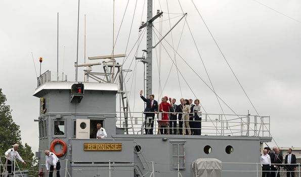 Hellevoetsluis,HOLLAND - JUNE 21:King Willem Alexander and Queen maxima waving to the dutch citizens,on June 21,2013 in Hellevoetsluis,Holland.They visit the citizins because of his coronation
