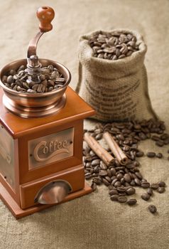 coffee beans cinnamon and coffee grinder