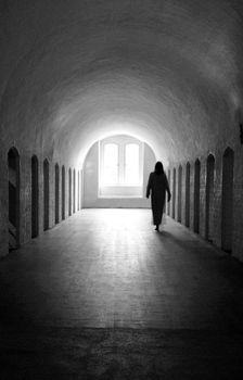 Woman ghost in medieval room.
