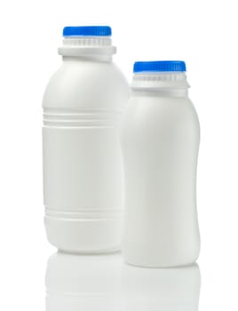 two plastical white bottle of yogurt