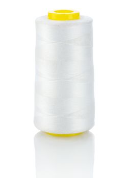 white thread on yellow spool