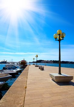 berth with street-lamp on sea background. Pula Croatia