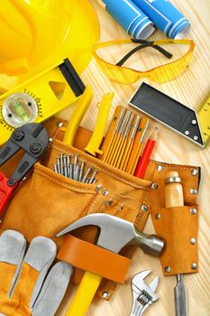 big composition of working tools on wooden boards