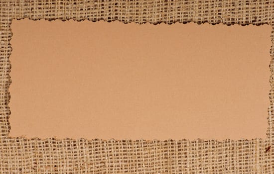 Old paper tag on natural burlap