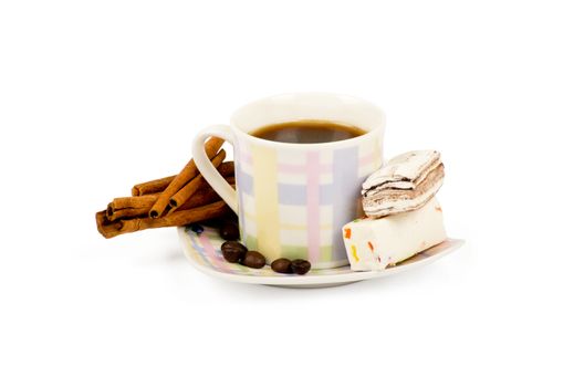 Coffee cup with sweets an cinnamon on white background