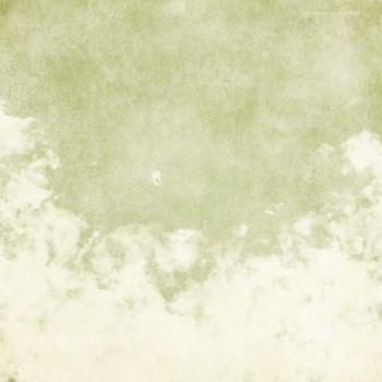 Sky, fog, and clouds on a textured, vintage paper background with grunge stains