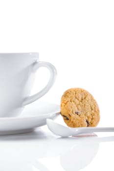 cup and spoon with cookie isolated