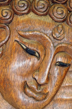 Wooden carving Buddha portrait souvenir of Thailand