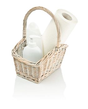 basket with bottles and paper towel