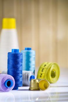 composition of spools and thimbles with measure tape