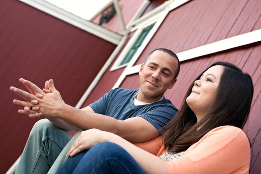 Young happy couple enjoying each others company outdoors.