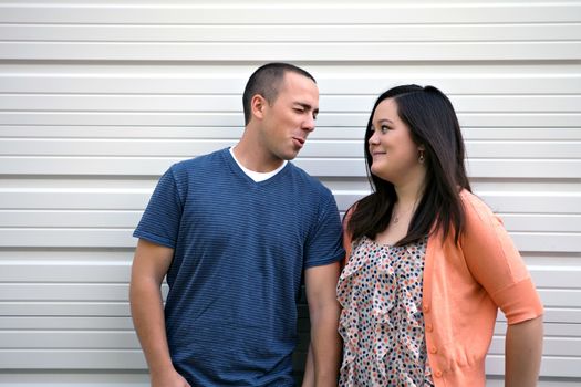 Young happy couple enjoying each others company outdoors.